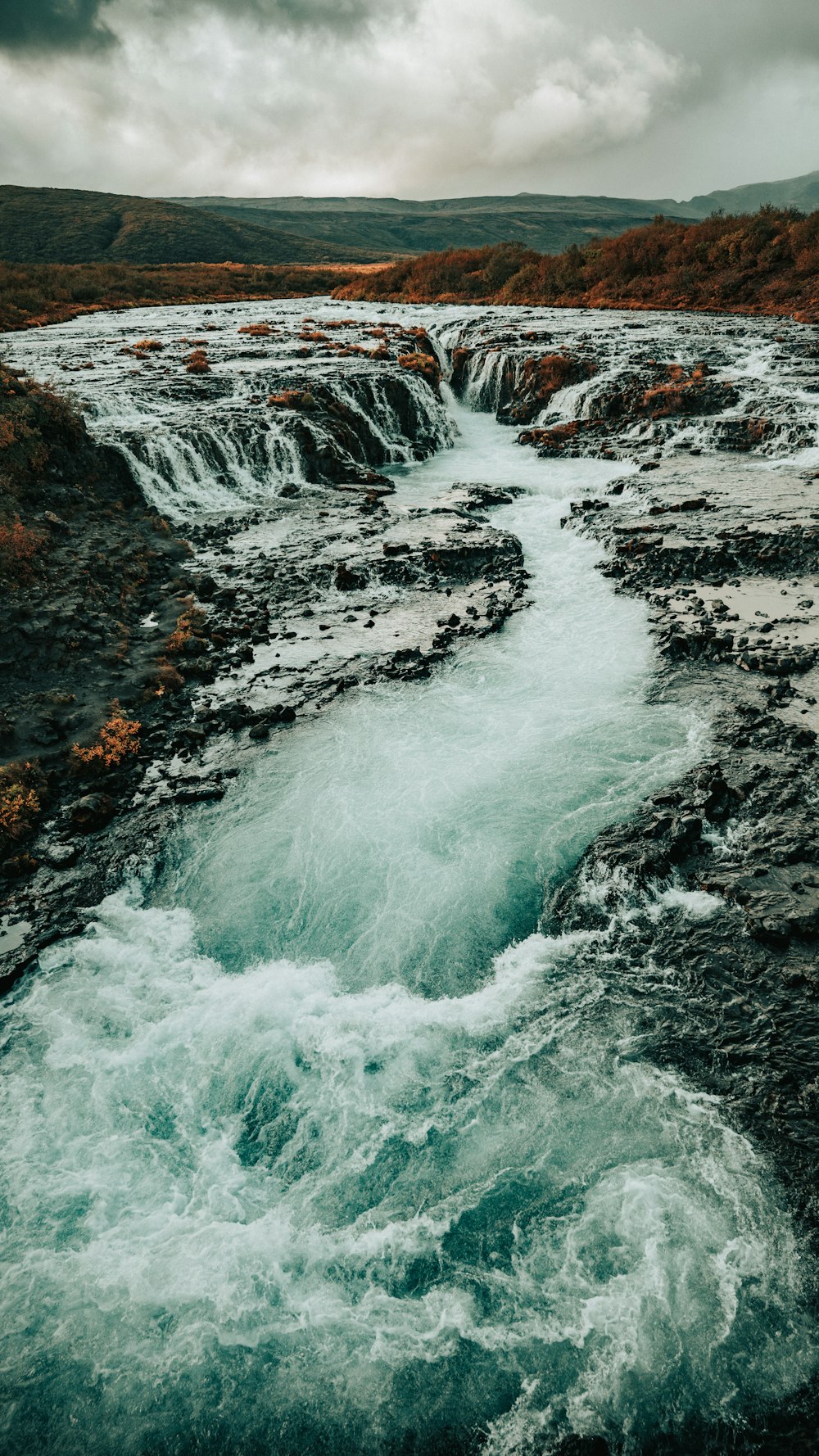 aerial photography of flowing multi-tier waterfall