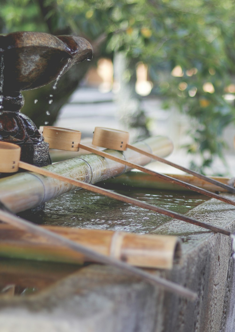 three brown bamboo cups