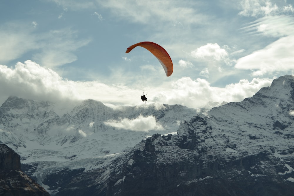 time lapse photography of man in a parachute