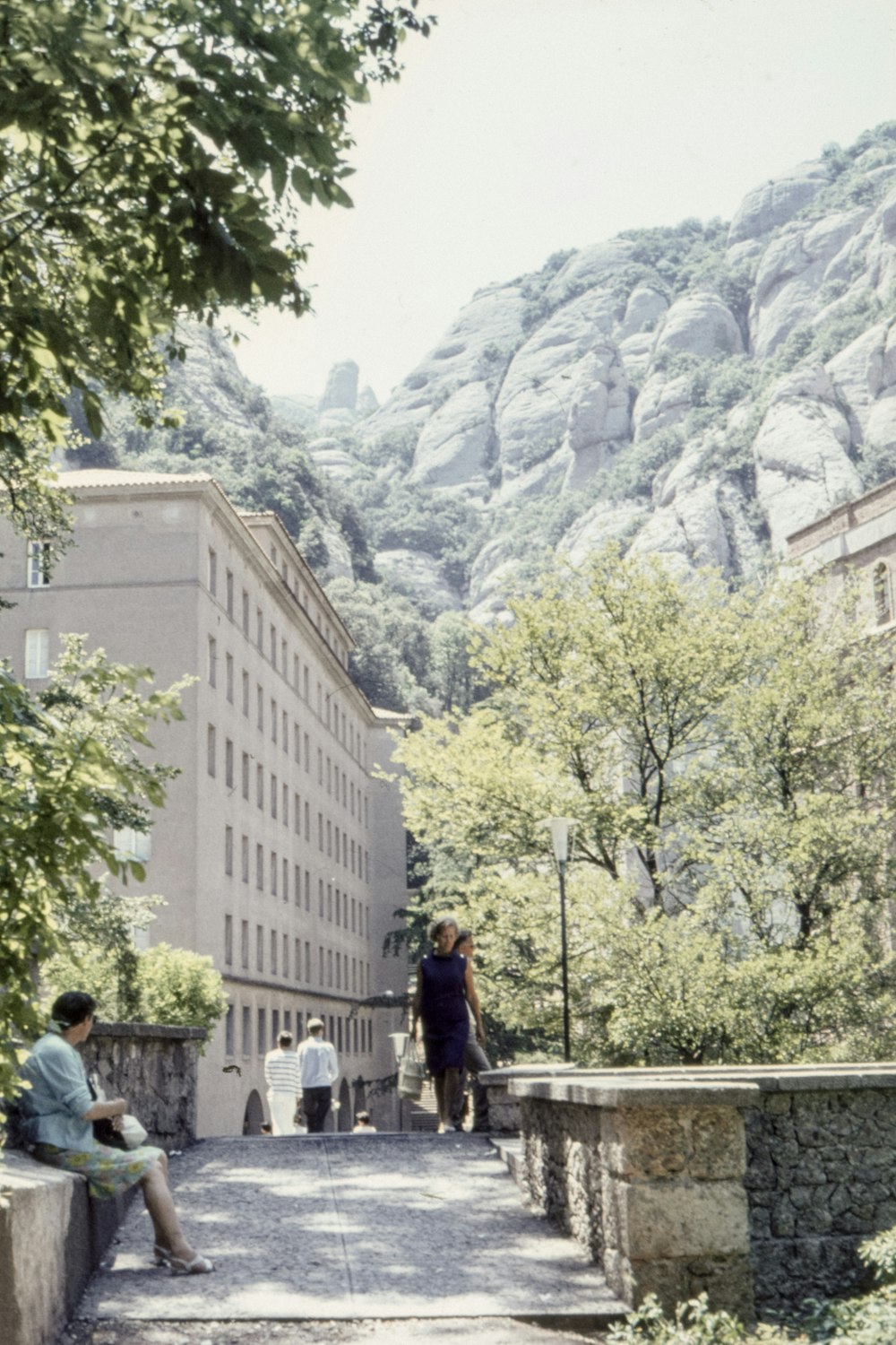 woman wearing purple dress walking on street