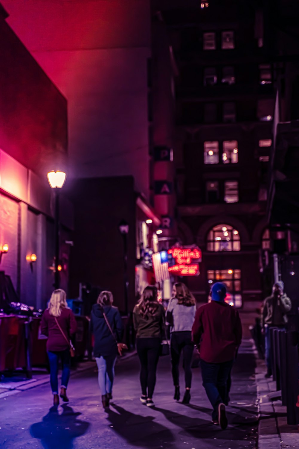 group of people walking on street