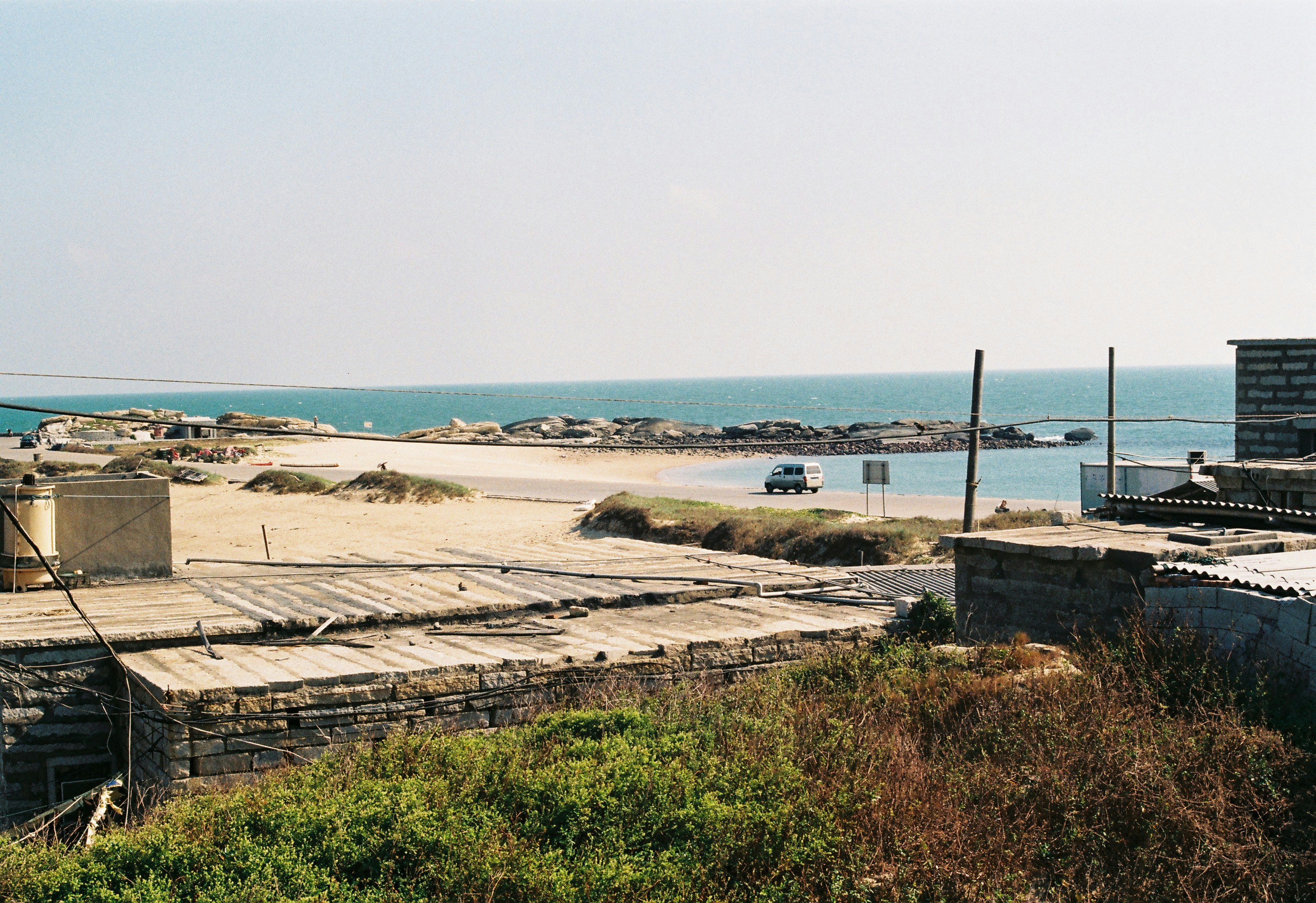 Image of an ideal location for a stiff arm, such as a dock near a concrete seawall in a protected cove - floating dock stiff arm