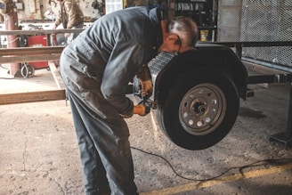 man fixing a vehicle tire
