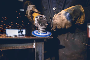 person using grinder tool