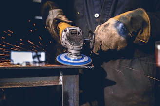 person using grinder tool