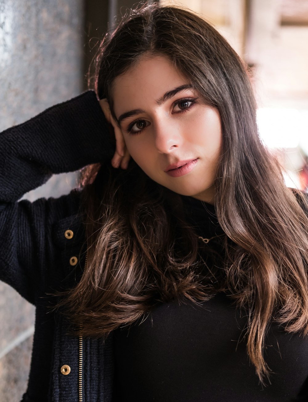 woman wearing black zip-up jacket and black shirt