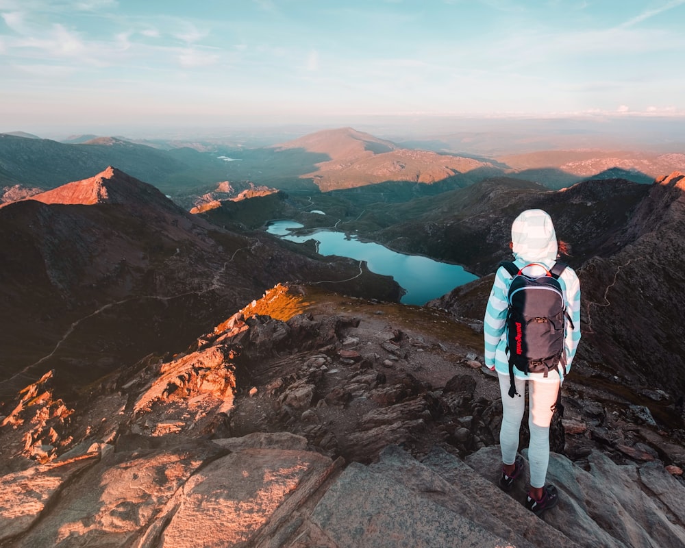 person standing on steeped mountain