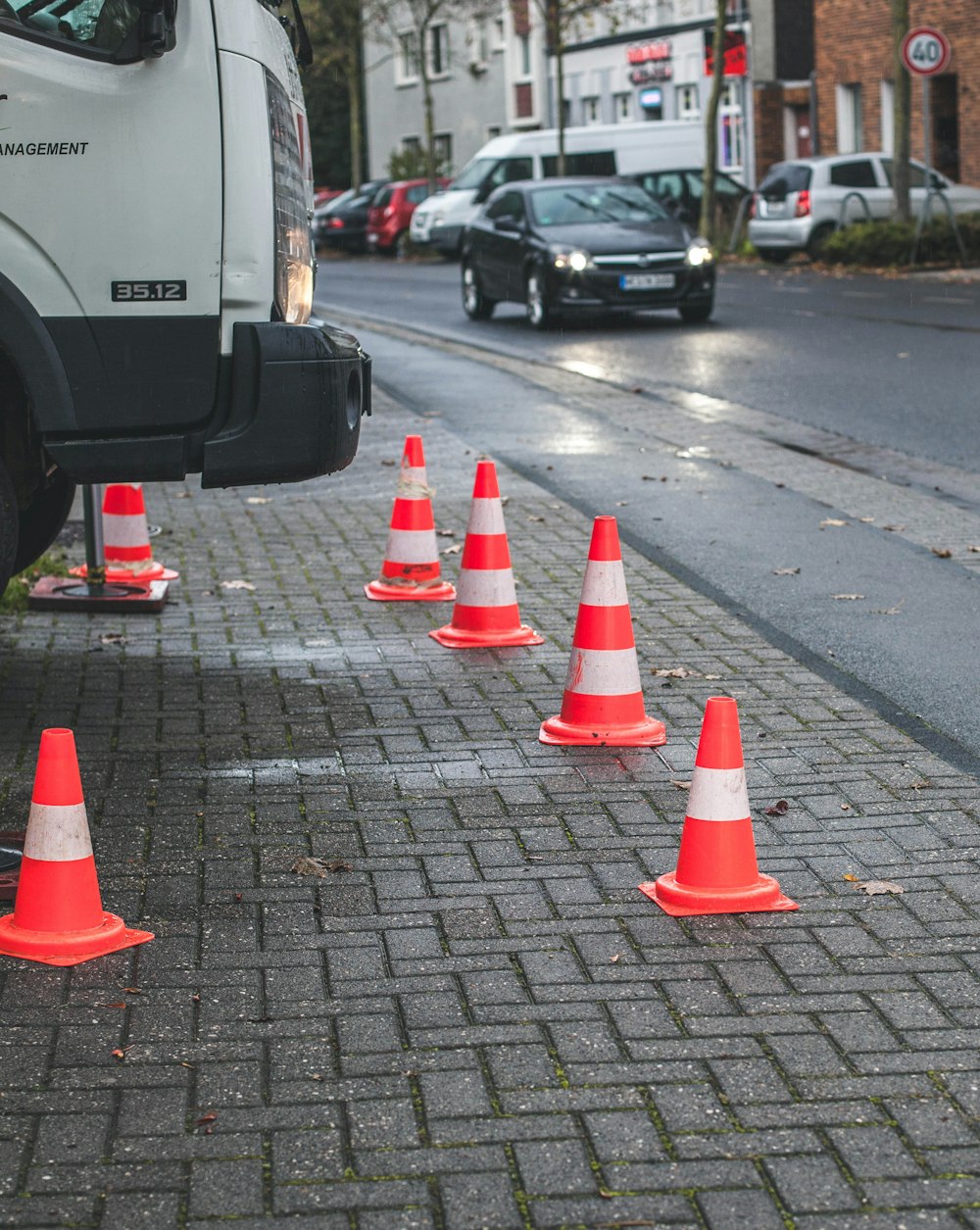 several parking cones on a parking lot