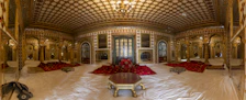 Spacious family suite featuring modern Islamic patterns and plush seating.