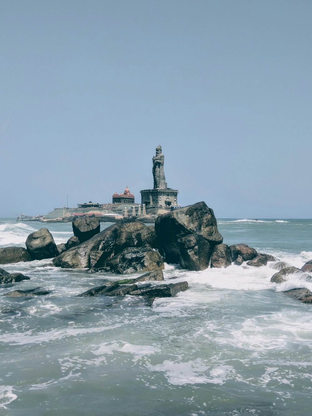 statue near ocean