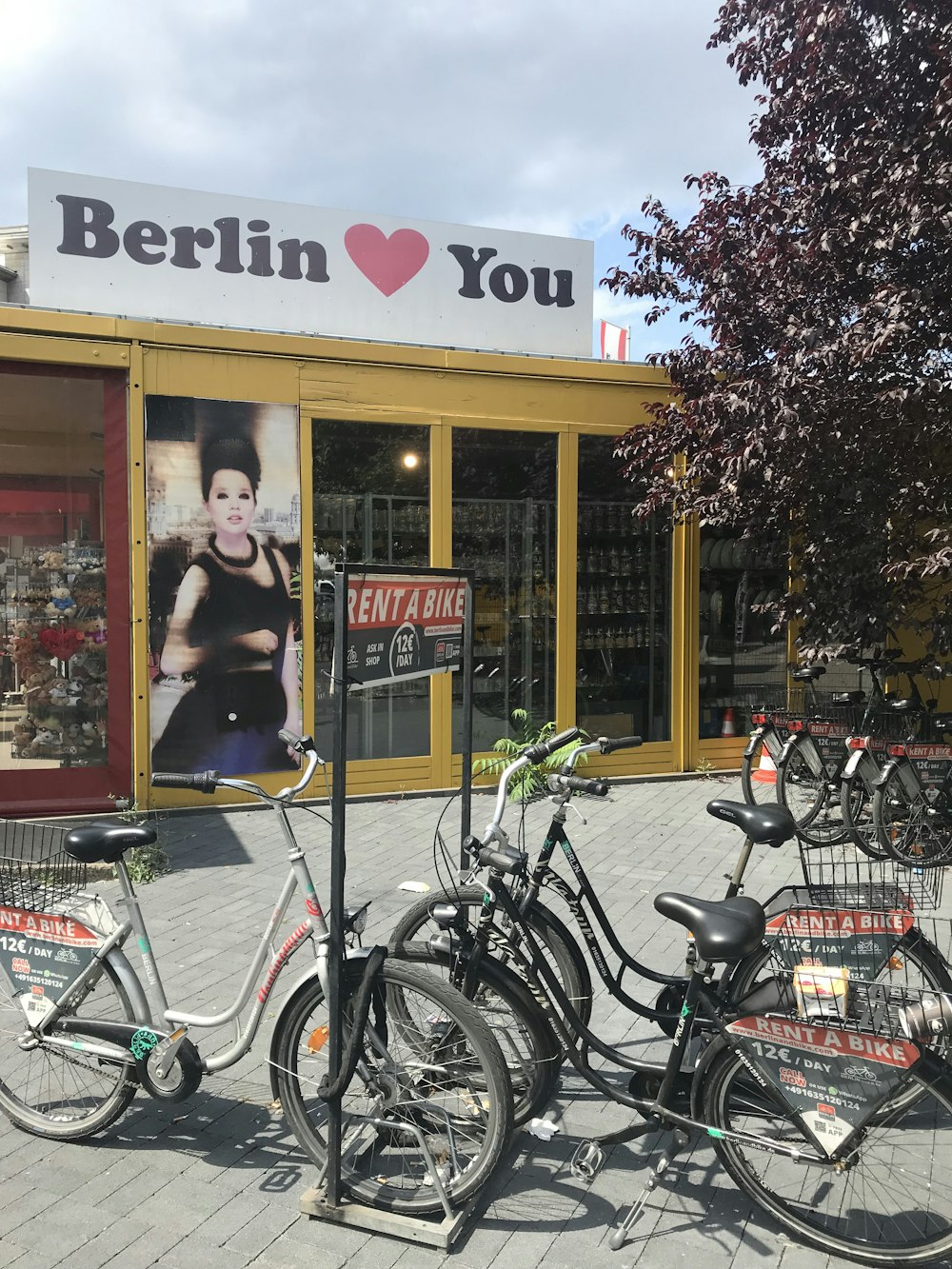 several cruiser bike parked near building