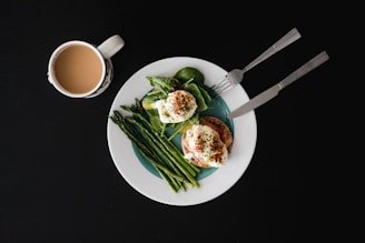 A beautifully arranged breakfast plate with eggs, toast, and fruits.