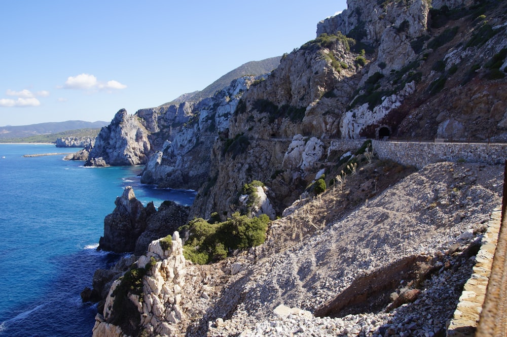 road on cliff near sea