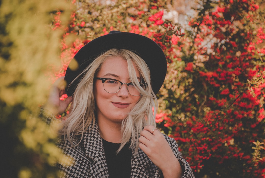 shallow focus photo of woman wearing black wide brim fedora hat