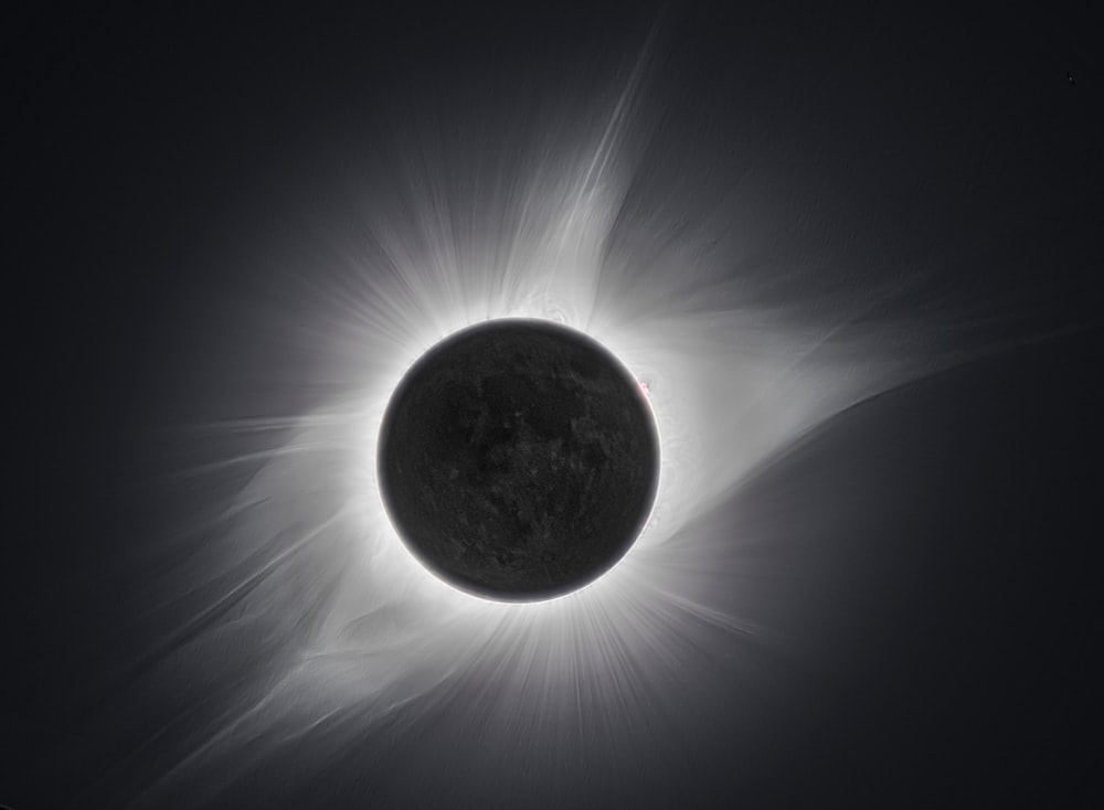 a solar eclipse is seen in the dark sky