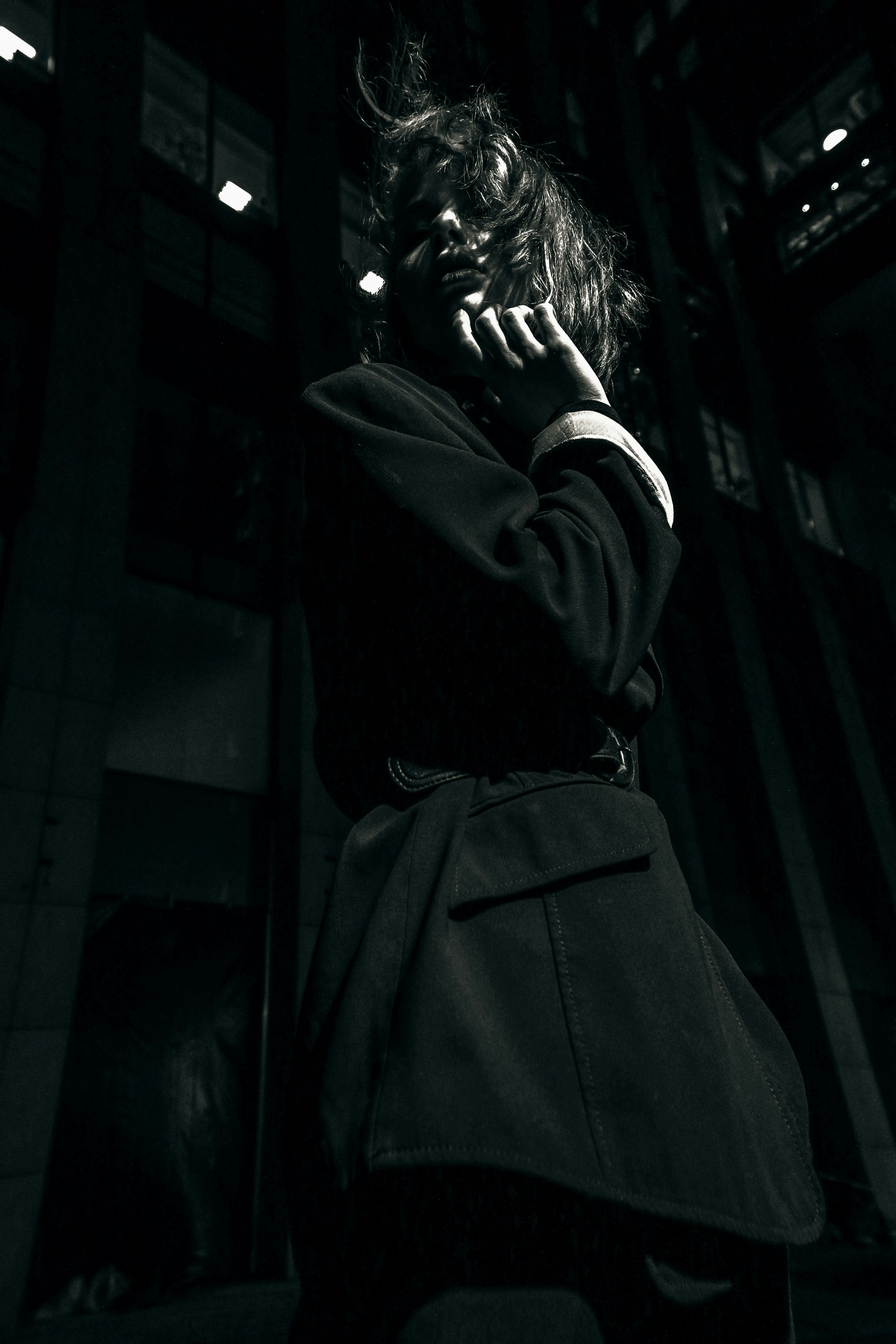 a woman talking on a cell phone in a dark room
