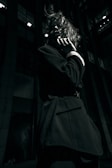 a woman talking on a cell phone in a dark room