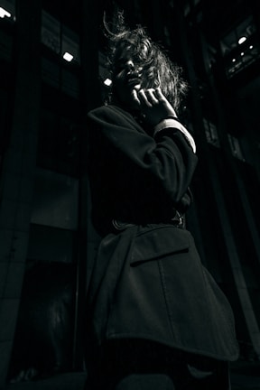 a woman talking on a cell phone in a dark room