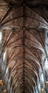 low-angle photogra[hy of brown wooden cathedral roof