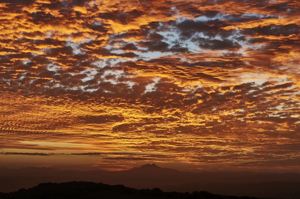 silhouette of mountain during golden hour