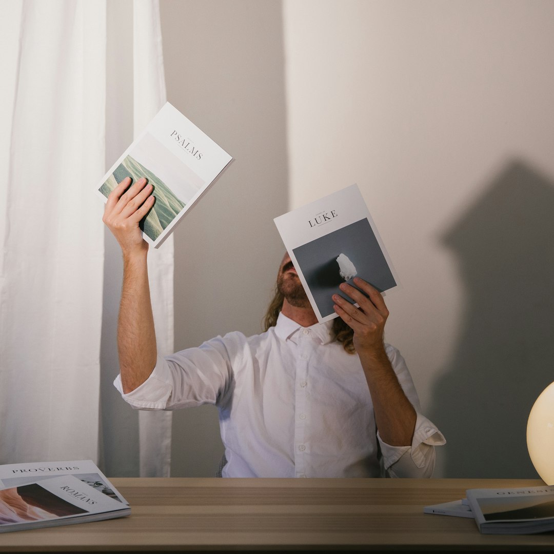 man holding books