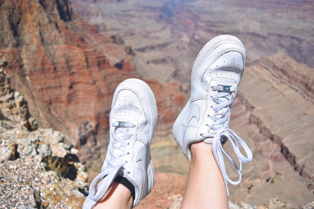 person wearing white Nike Air Force 1