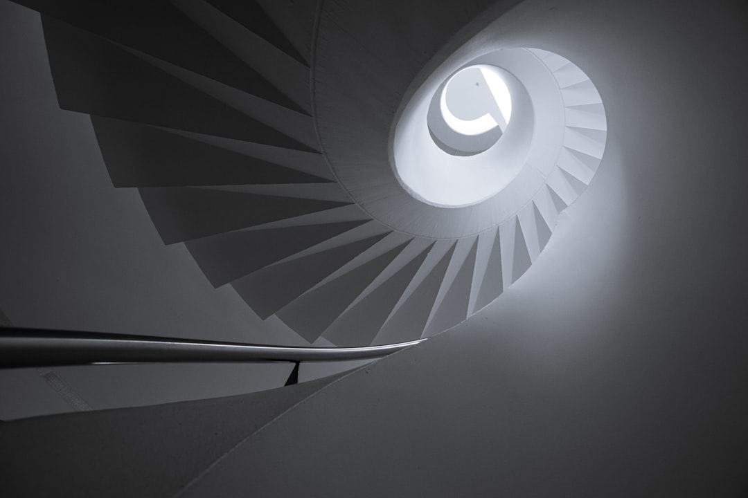 architectural photography of spiral stair