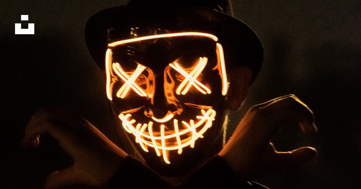 Man wearing hat with X-eyes mask photo – Free Human Image on Unsplash