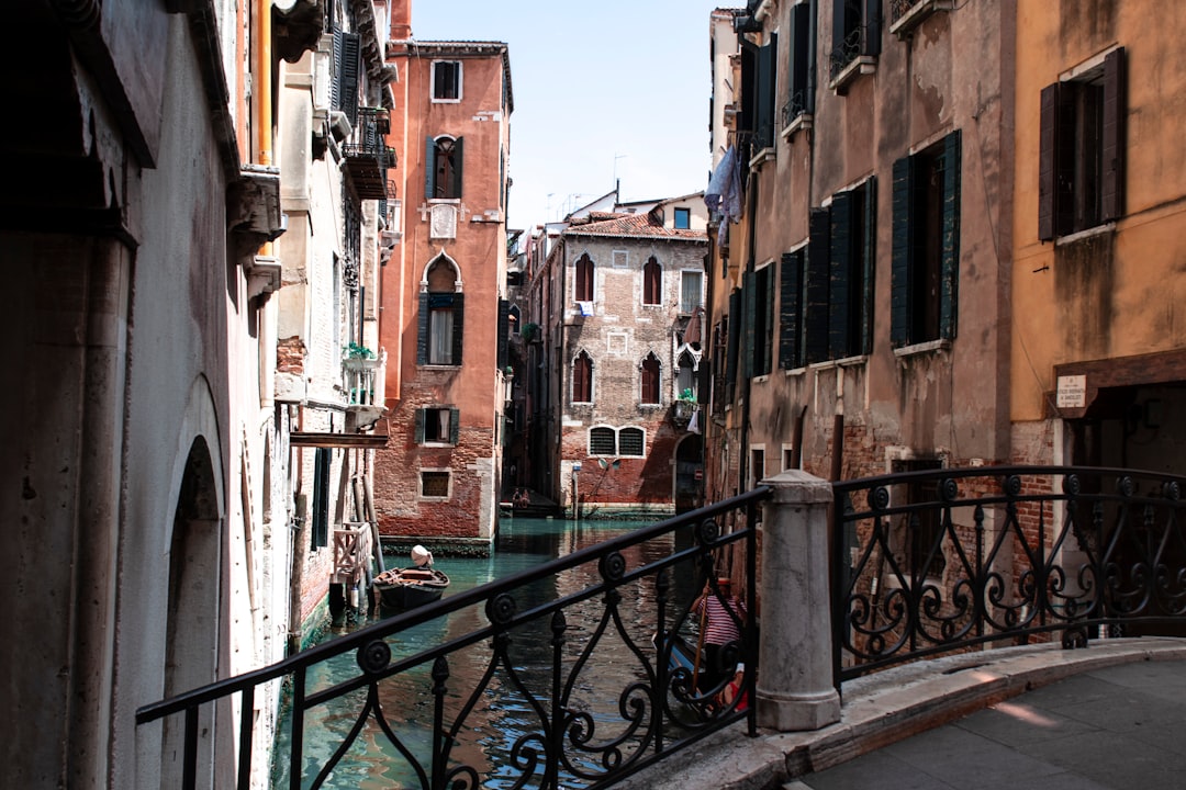 Venice Italy buildings and canal under white and blue sky during daytime