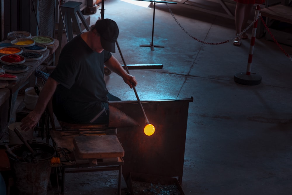 man sitting on wood