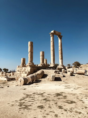 Traveler wearing lightweight AR glasses while exploring ancient ruins