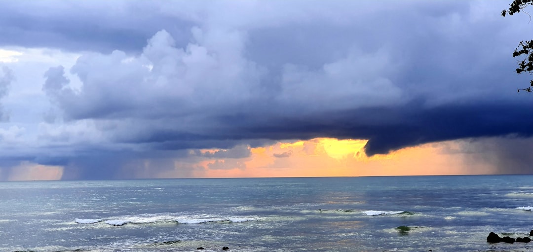 ocean under cloudy sky