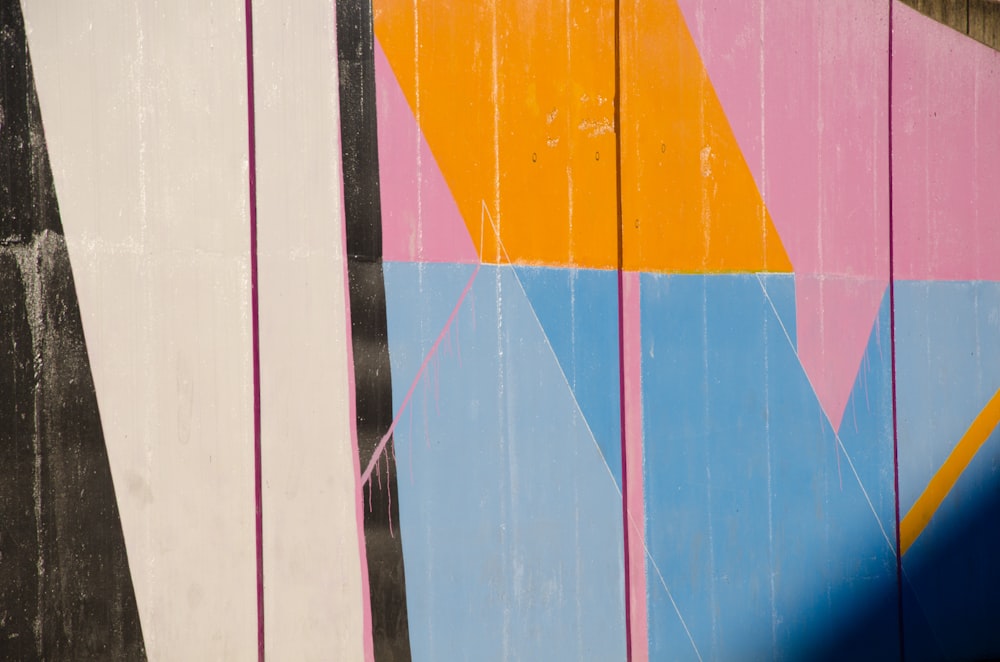 blue, orange, and pink wooden plank