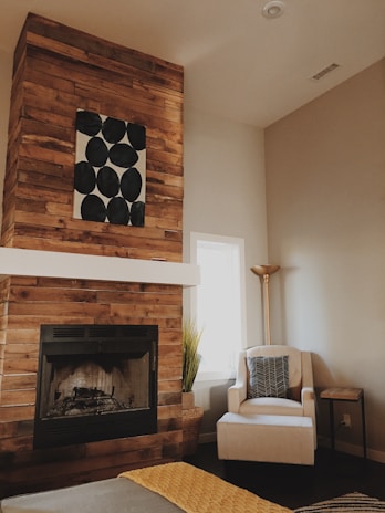 A cozy living room featuring custom wood art as a focal point.