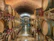 Rustic wooden barrels lined up in a dimly lit cellar of Bodegas y Viñedos Sanz Moneo.