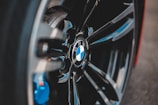 Close-up of a sleek BMW wheel with Transit Torque branded brake calipers.