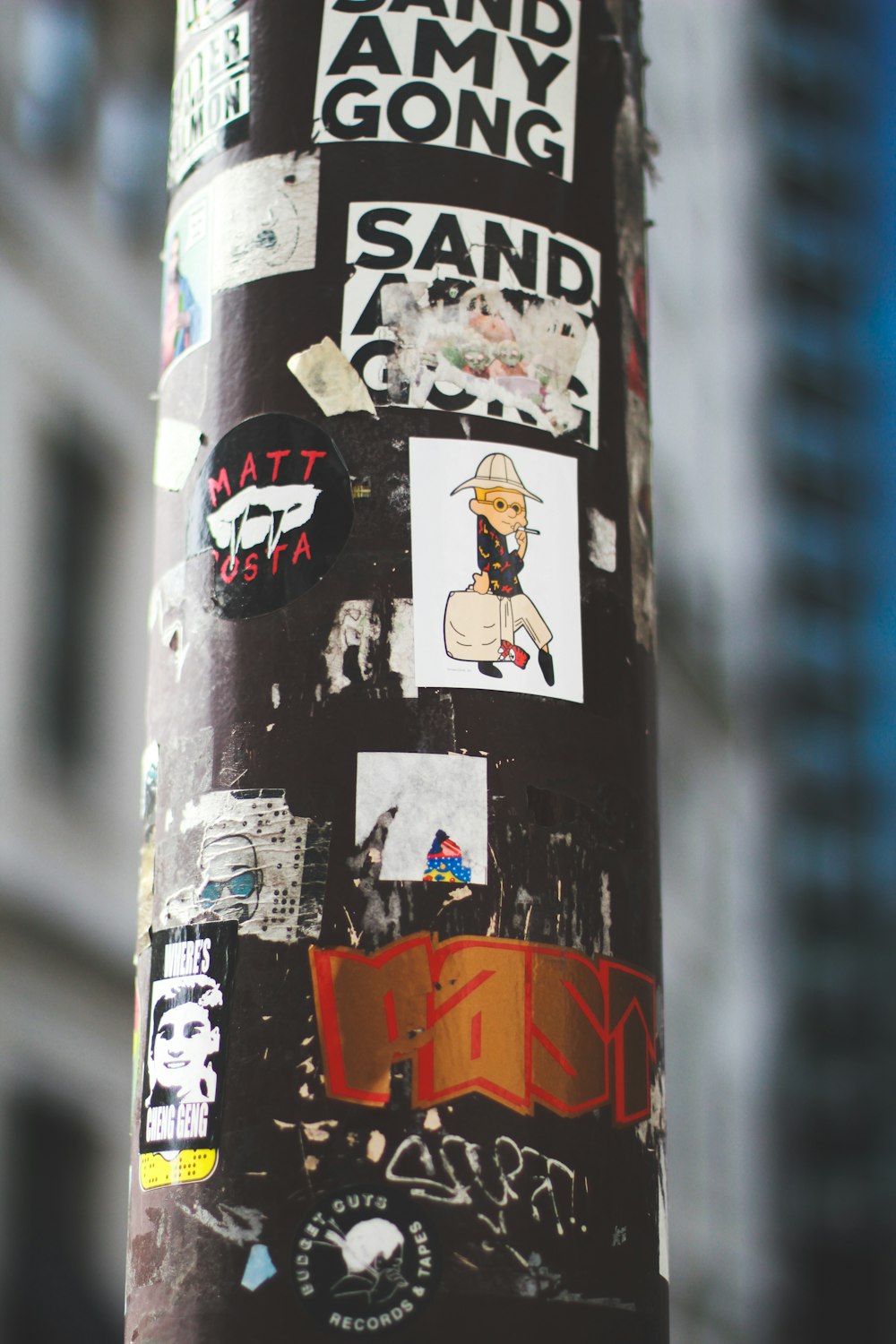black metal pole with stickers