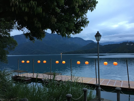 lamp post near body of water in Sun Moon Lake Taiwan