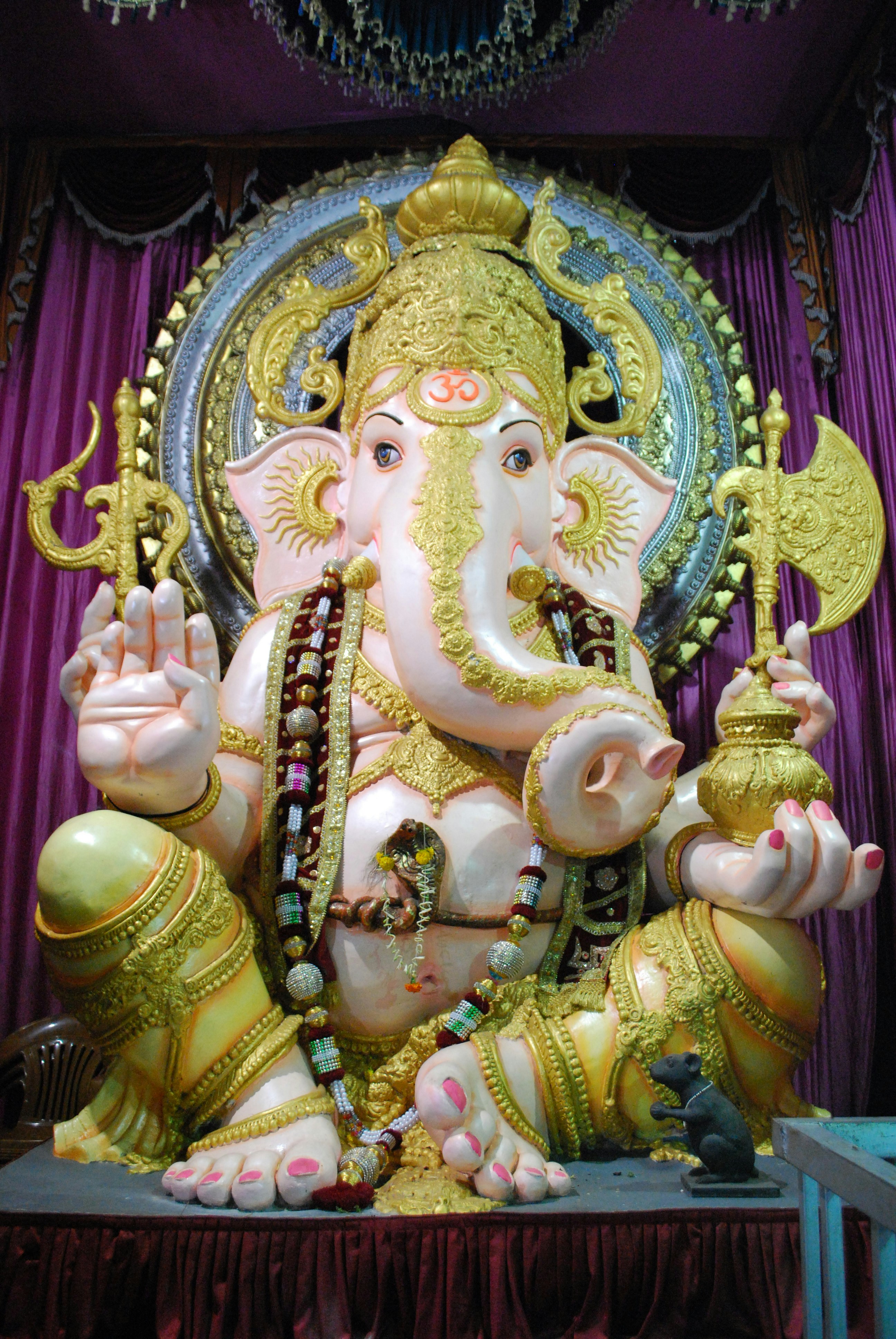 Yellow and beige lord ganesha figurine photo – Free Tulshibaug ...