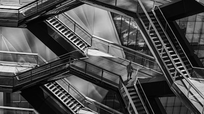 Dark abstract architectural lines forming a complex network of pathways.