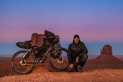 man sitting near motorcycle