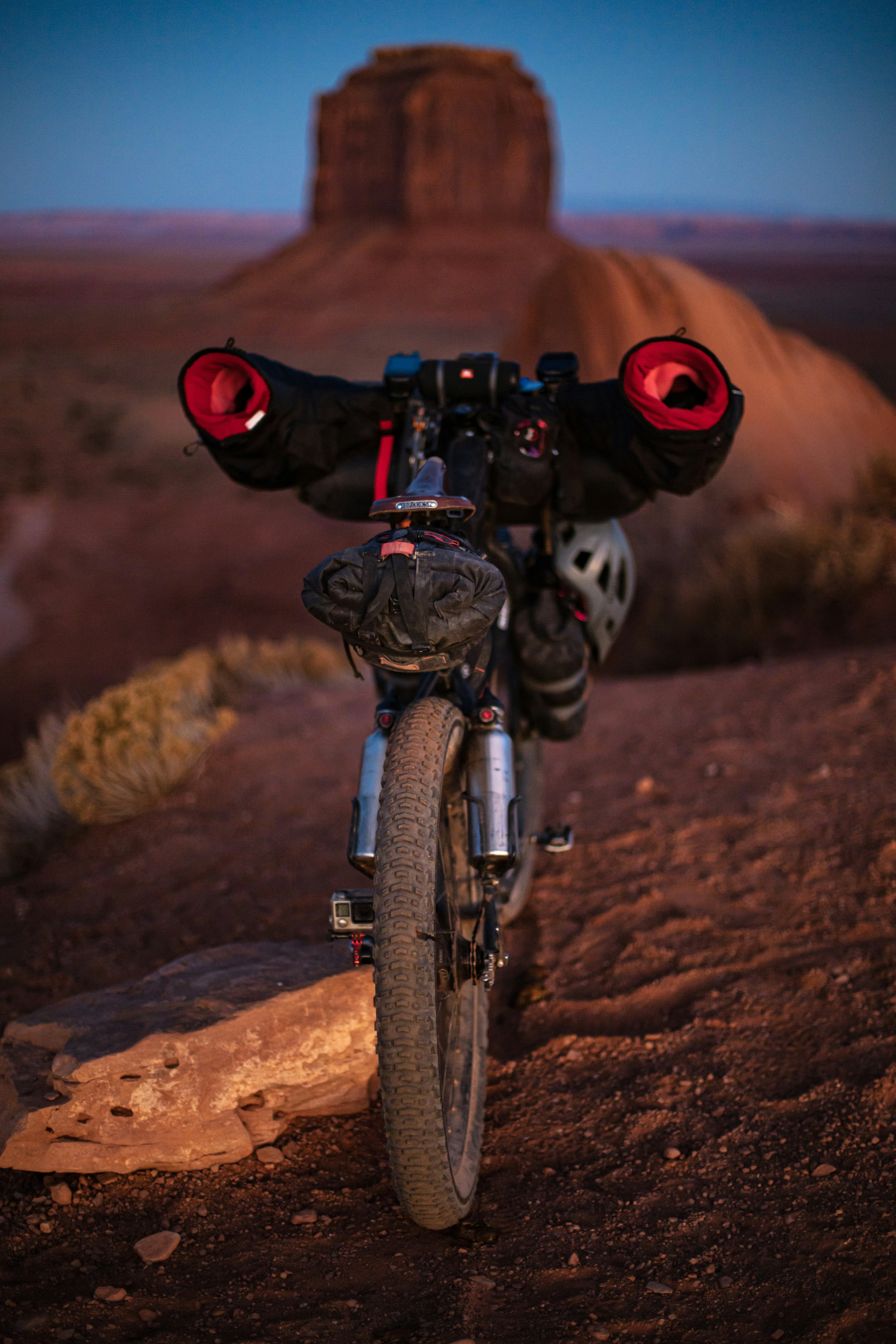 black motorcycle on brown mountain