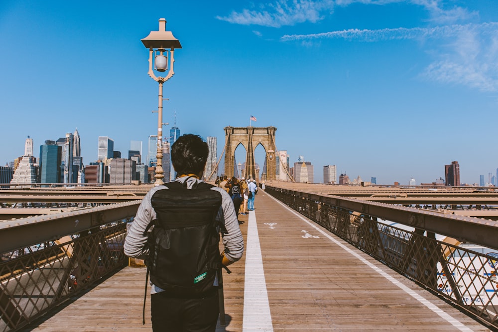 people walking on bridge during daytime