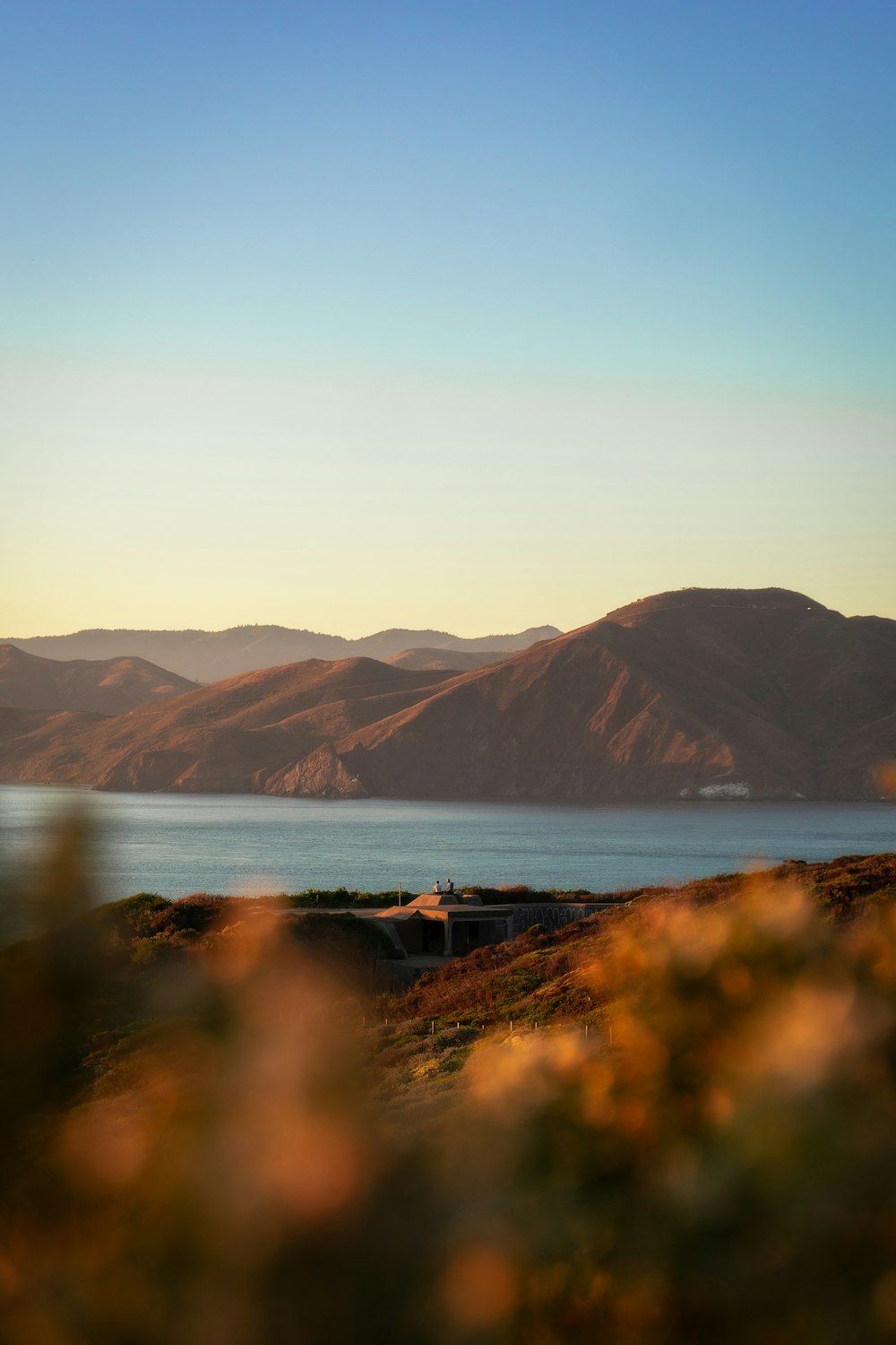 river beside mountains during daytime