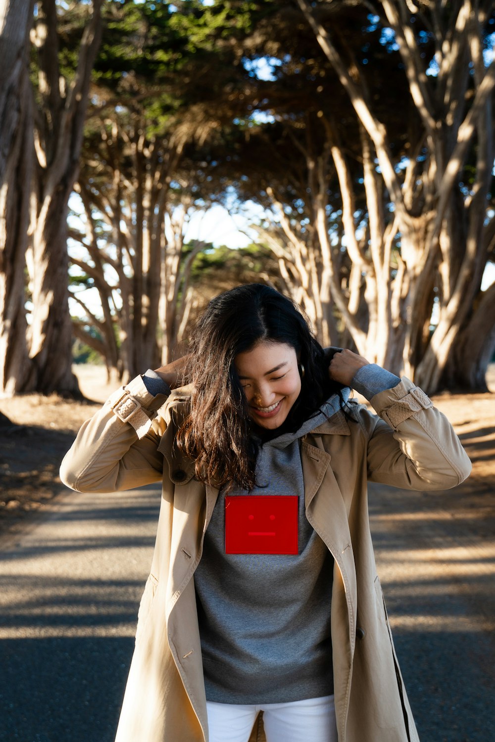 woman wearing brown coat