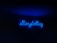 A neon sign with the word 'Storytelling' illuminated in bright blue against a dark background.