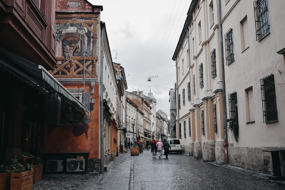 group of people on street in between of buildings