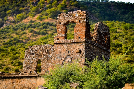 architectural photography of brown and gray concrete monument in Bhangarh India