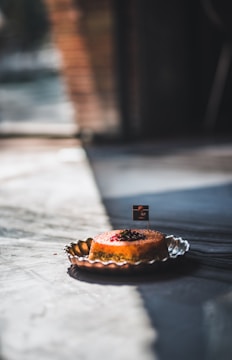 Artfully plated dessert with rich textures and moody shadows.