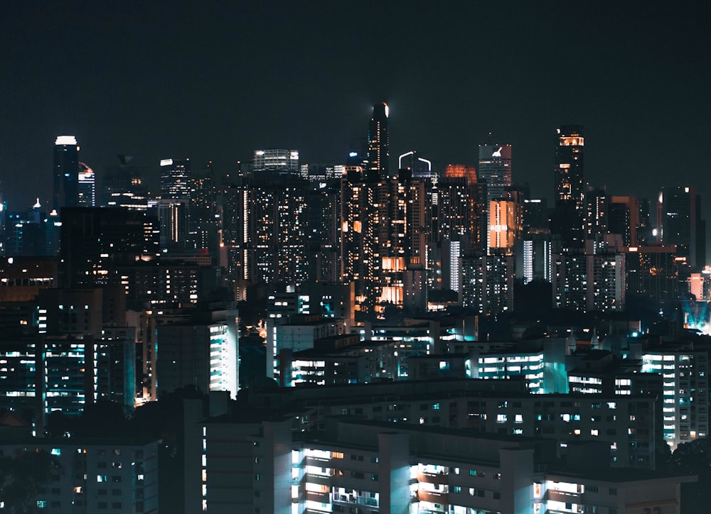 a city at night with a lot of buildings lit up